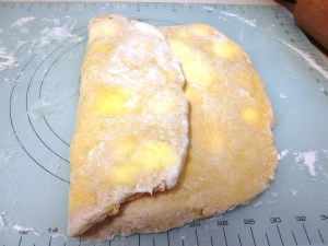 Folding first third over middle third.